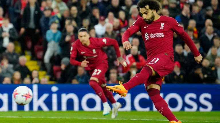 Liverpool's Mohamed Salah score his side's first goal on a penalty kick during the English Premier League soccer match between Liverpool and Fulham, at Anfield Stadium, Liverpool, England, Wednesday, May 3, 2023. (AP Photo/Jon Super)