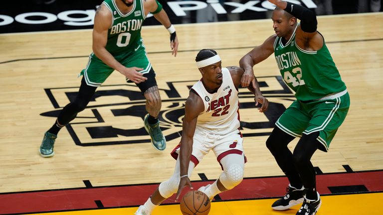 Boston Celtics center Al Horford (42) defends Miami Heat forward Jimmy Butler (22).