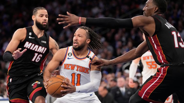 Miami Heat forward Caleb Martin (16) and center Bam Adebayo (13) guard New York Knicks guard Jalen Brunson (11) in the second half of Game 2 in the NBA basketball Eastern Conference semifinals playoff series, Tuesday, May 2, 2023, at Madison Square Garden in New York. The Knicks won 111-105. 