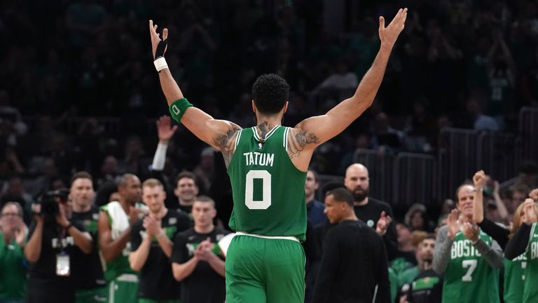 Boston Celtics forward Jayson Tatum receives applause for scoring a record-breaking 51 points against the Philadelphia 76ers in Game 7.