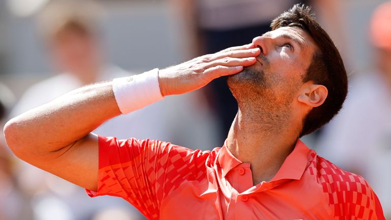Serbia's Novak Djokovic celebrates after winning the first round match of the French Open tennis tournament against Aleksandar Kovacevic of the U.S. in three sets, 6-3, 6-2, 7-6 (7), at the Roland Garros stadium in Paris, Monday, May 29, 2023. (AP Photo/Jean-Francois Badias)