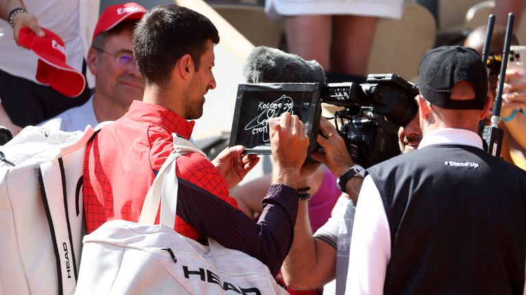 Novak Djokovic of Serbia writes in Serbian on the camera lens a political statement, &#39;Kosovo is the heart of Serbia. Stop the violence&#39; about the tensions between Kosovo and Serbia after his first round victory during day 2 of the 2023 French Open, Roland-Garros 2023, second Grand Slam tennis tournament of the season at Stade Roland-Garros on May 29, 2023 in Paris, France.