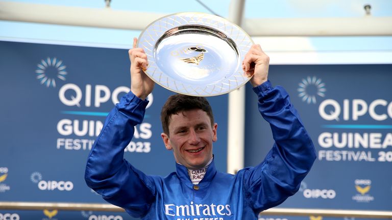 Oisin Murphy lifts the 1000 Guineas trophy after riding Mawj to victory