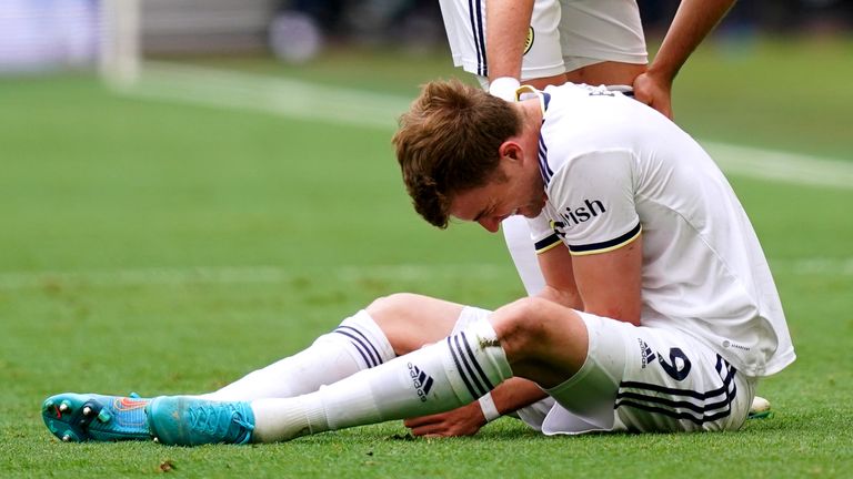 Patrick Bamford sits injured on the pitch