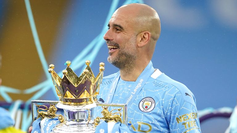 Pep Guardiola with the Premier League trophy