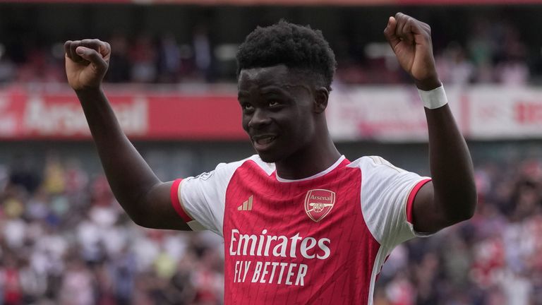 Bukayo Saka celebrates after scoring Arsenal's third goal against Wolves