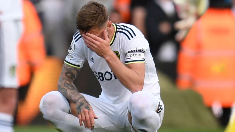 Liam Cooper shows his dejection following Leeds United&#39;s relegation from the Premier League