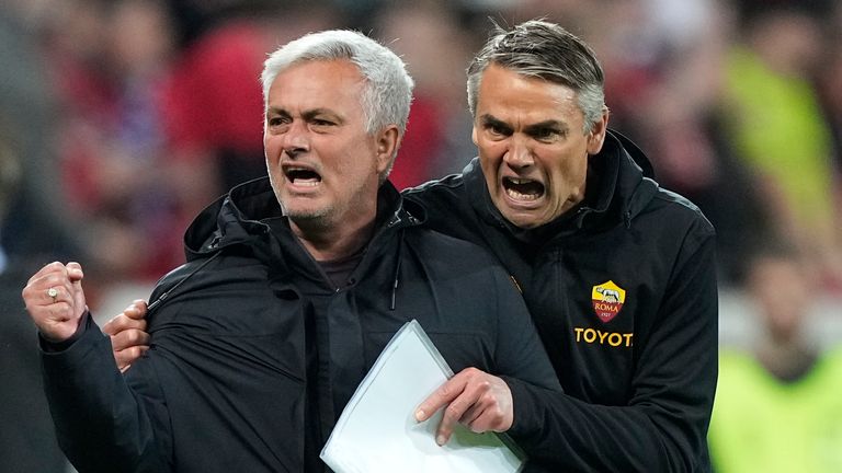 Roma's head coach Jose Mourinho, left, celebrates 