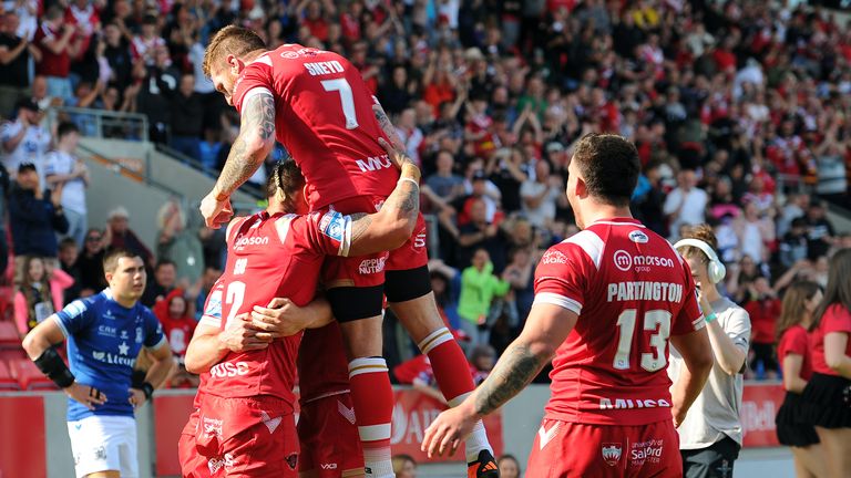 Picture by John Rushworth/SWpix.com - 28/05/2023 - Rugby League - Betfred Super League Round 13 - Salford Red Devils v Hull FC - AJ Bell Stadium, Salford, England - Salford Red Devils celebrate scoring their fifth try