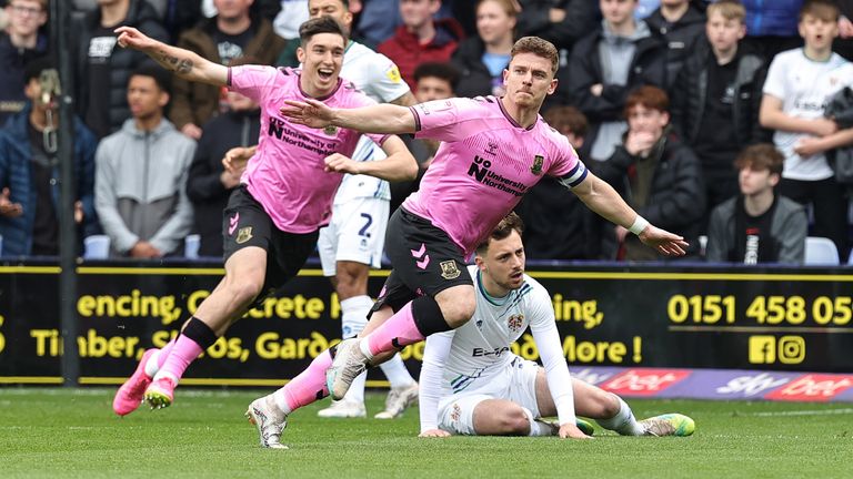 Hoskins celebrates after scoring