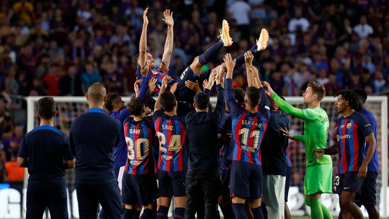 Barcelona's Sergio Busquets is thrown in the air by team mates after his last home game of the season for the club at the end of a Spanish La Liga soccer match between Barcelona and Mallorca at the Camp Nou stadium in Barcelona, Spain, Sunday, May 28, 2023. (AP Photo/Joan Monfort)