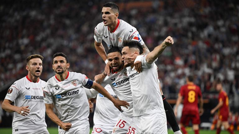 Sevilla players celebrate their team's first goal against Roma in the Europa League final