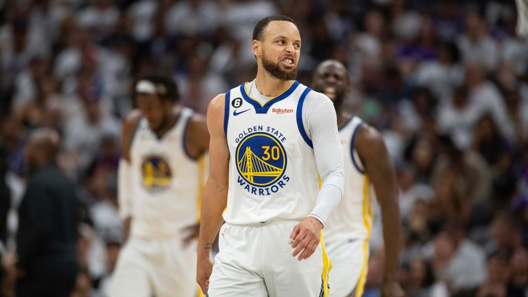 Golden State Warriors guard Stephen Curry reacts to a fans comments during the second half of Game 7 of an NBA basketball first-round playoff series against the Sacramento Kings
