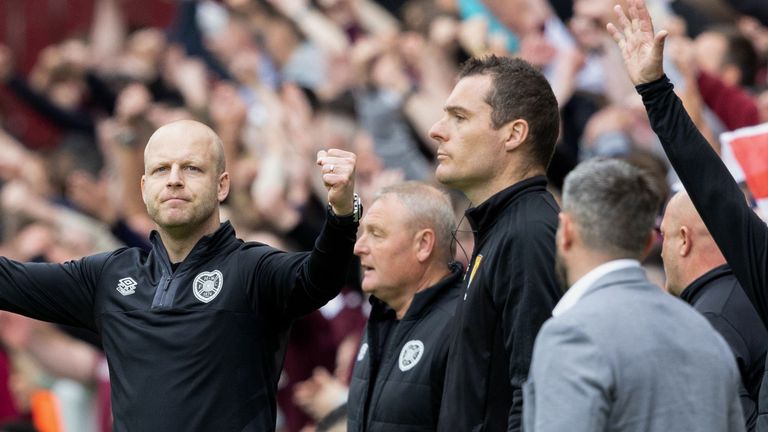 EDINBURGH, SCOTLAND - MAY 27: Hearts&#39; interim manager Steven Naismith (L) celebrates the full-time whistle whilst Hibernian manager Lee Johsnon watches on after a cinch Premiership match between Heart of Midlothian and Hibernian at Tynecastle Park, on May 27, 2023, in Edinburgh, Scotland. (Photo by Mark Scates / SNS Group)