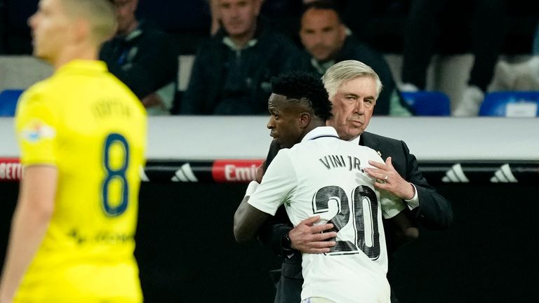 Real Madrid's Vinicius Junior celebrates with Real Madrid's head coach Carlo Ancelotti after scoring his side's second goal during a Spanish La Liga soccer match between Real Madrid and Villarreal at the Santiago Bernabeu stadium in Madrid, Saturday, April 8, 2023. (AP Photo/Jose Breton)