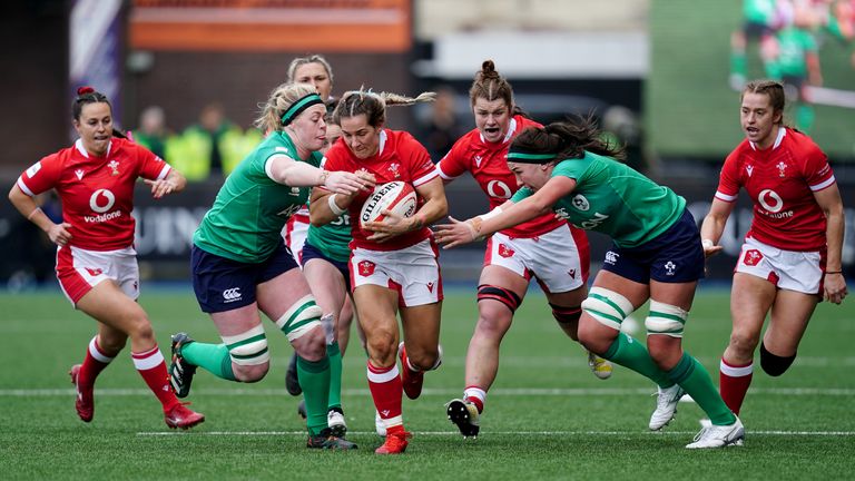 Wales' Kerin Lake (centre) is tackled by Ireland's Sam Monaghan (left) during the TikTok Women's Six Nations