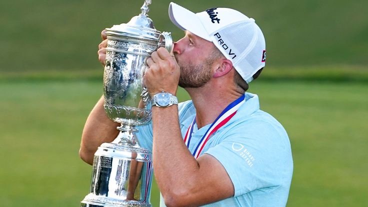 Wyndham Clark lifts the trophy after winning after the US Open