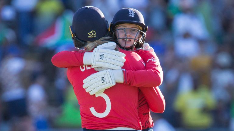 England's Amy Jones consoles England's Heather Knight after loosing to South Africa during the Women's T20 World Cup semi final cricket match in Cape Town, South Africa, Friday Feb. 24, 2023. (AP Photo/Halden Krog)