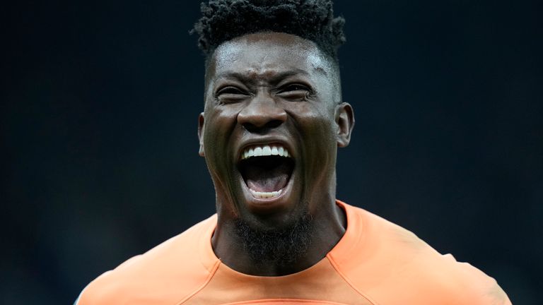 Inter Milan's goalkeeper Andre Onana celebrates after Inter Milan's Lautaro Martinez scored his side's opening goal during the Champions League semifinal second leg soccer match between Inter Milan and AC Milan at the San Siro stadium in Milan, Italy, Tuesday, May 16, 2023. (AP Photo/Antonio Calanni)