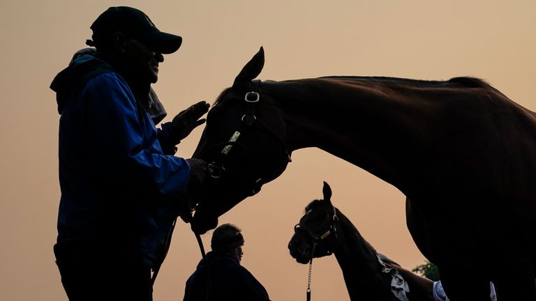 Haze caused by northern wildfires hangs over horses and their handlers ahead of the Belmont Stakes