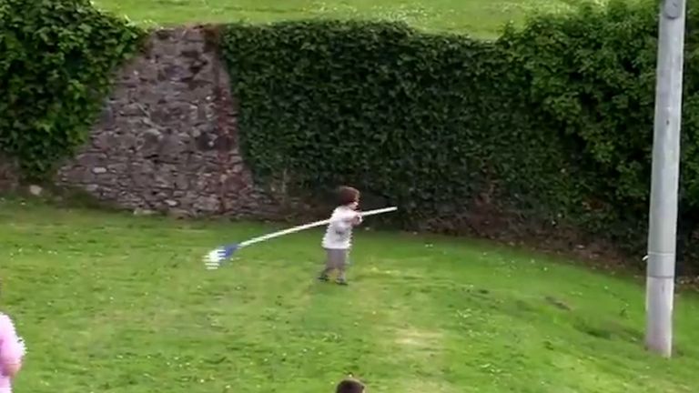 Screengrab from video of toddler taking corner flag.