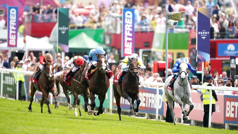 Regal Reality (light blue, middle) beats Highland Avenue in the Betfred Diomed Stakes at Epsom