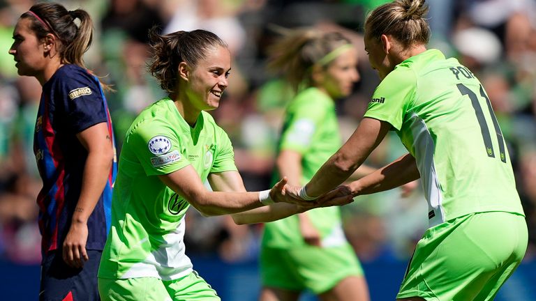 Wolfsburg's Ewa Pajor celebrates with team-mate Alexandra Popp after scoring