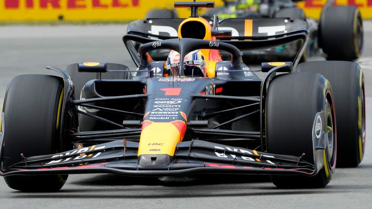 Red Bull Racing's Max Verstappen, of the Netherlands, rides in front of Aston Martin driver Fernando Alonso, of Spain, during the Formula One Canadian Grand Prix auto race, Sunday, July 18, 2023, in Montreal. (Paul Chiasson/The Canadian Press via AP)