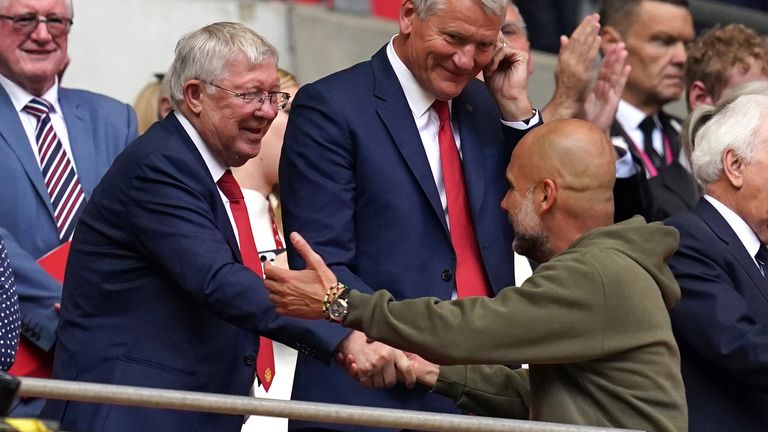 Sir Alex Ferguson greets Manchester City manager Pep Guardiola following the Emirates FA Cup final