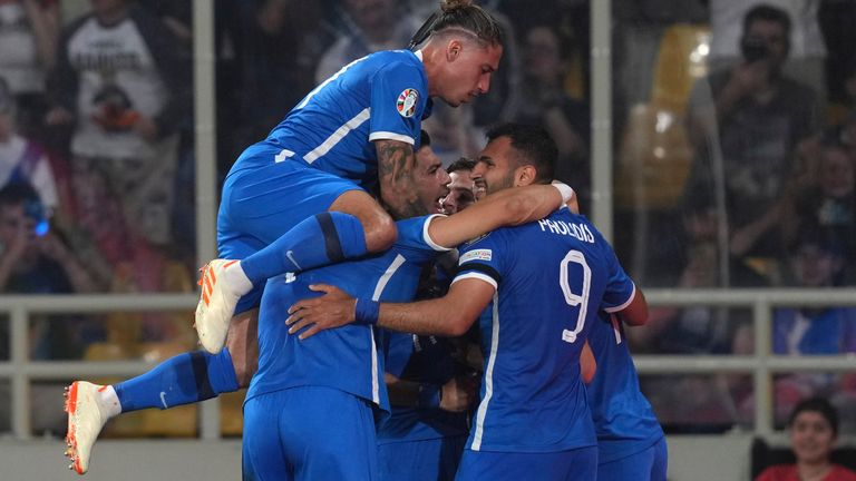 Greece's Tasos Bakasetas celebrates with his teammates after scoring his side's opening goal during the Euro 2024 group B qualifying soccer match between Greece and Ireland at the OPAP Arena in Athens, Greece, Friday, June 16, 2023. (AP Photo/Petros Giannakouris)