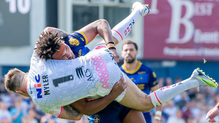 Wakefield's Hugo Salabio upends Leeds' Richie Myler (picture by Allan McKenzie/SWpix.com)