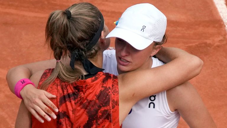 Poland's Iga Swiatek, right, hugs Karolina Muchova of the Czech Republic after winning the women's final match of the French Open tennis tournament against Karolina Muchova of the Czech Republic in three sets, 6-2, 5-7, 6-4, at the Roland Garros stadium in Paris, Saturday, June 10, 2023. (AP Photo/Christophe Ena)