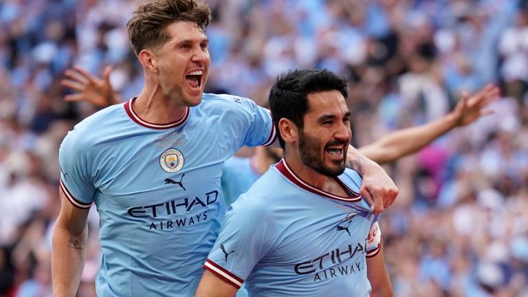 Ilkay Gundogan celebrates his, and City&#39;s, second goal of the game with John Stones