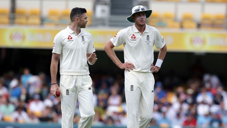 England's James Anderson, left, and Stuart Broad talk each other during their Ashes cricket test against Australia in Brisbane, Australia, Monday, Nov. 27, 2017. (AP Photo/Tertius Pickard)