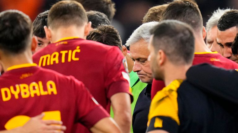 Roma's head coach Jose Mourinho, centre, talks to the players at the end of the Europa League final soccer match between Sevilla and Roma, at the Puskas Arena in Budapest, Hungary, Wednesday, May 31, 2023. Sevilla defeated Roma 4-1 in a penalty shootout after the match ended tied 1-1. (AP Photo/Petr David Josek)