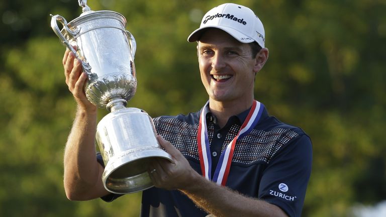 ADVANCE FOR WEEKEND EDITIONS, JUNE 7-8 - In this June 16, 2013, file photo, Justin Rose, of England, holds his trophy after winning the U.S. Open golf tournament at Merion Golf Club in Ardmore, Pa. Rose, the defending champion, is the latest player to have a chance to join Curtis Strange as the only back-to-back U.S. Open champions in the last 60 years. (AP Photo/Darron Cummings, File)