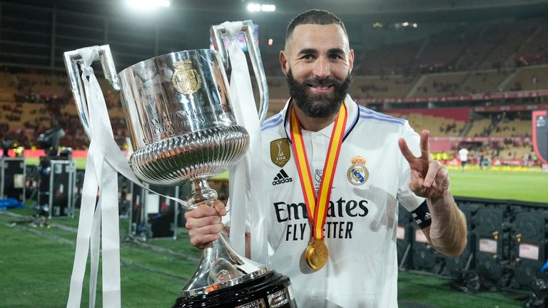 Karim Benzema poses with the trophy after Real Madrid&#39;s 2-1 defeat of Osasuna in the Copa del Rey final