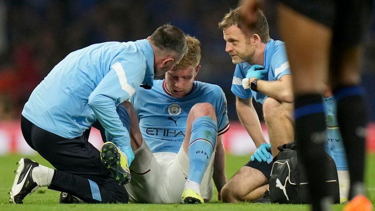 Manchester City&#39;s Kevin De Bruyne is assisted after getting injured during the Champions League final