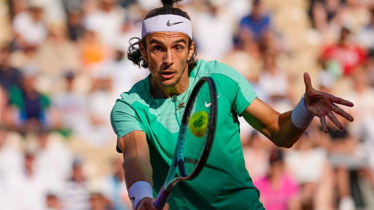 Italy&#39;s Lorenzo Musetti plays a shot against Britain&#39;s Cameron Norrie during their third round match of the French Open tennis tournament at the Roland Garros stadium in Paris, Friday, June 2, 2023. (AP Photo/Thibault Camus)