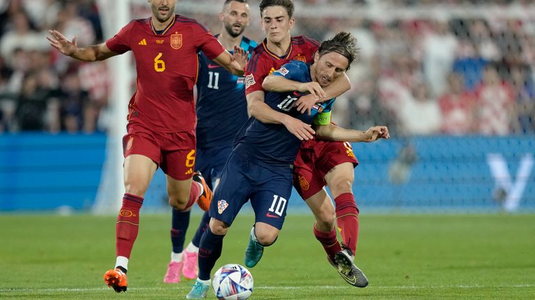 Luka Modric wins a free kick off Gavi during the game