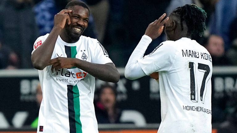 Moenchengladbach&#39;s Marcus Thuram, left, celebrates with Moenchengladbach&#39;s Manu Kone after scoring his side&#39;s third goal during the German Bundesliga soccer match between Borussia Moenchengladbach and Bayern Munich at the Borussia Park in Moenchengladbach, Germany, Saturday, Feb. 18, 2023. (AP Photo/Martin Meissner)