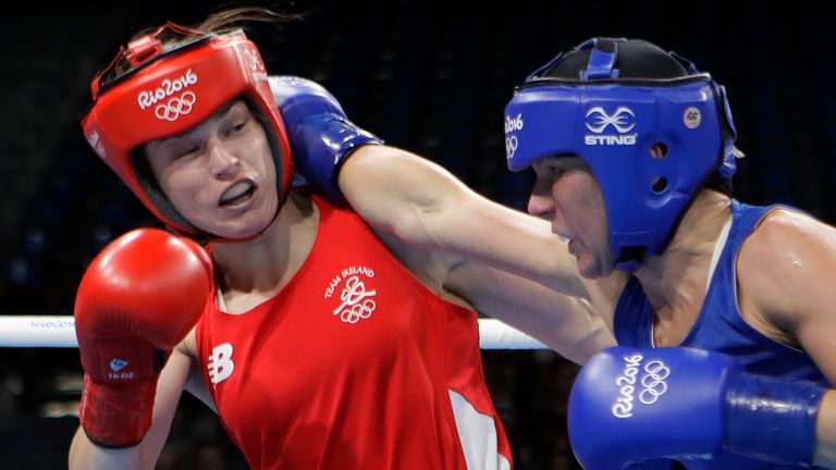 FILE - Finland's Mira Potkonen, right, fights Ireland's Katie Taylor during a women's lightweight 60-kg quarterfinals boxing match at the 2016 Summer Olympics in Rio de Janeiro, Brazil, on Aug. 15, 2016. Katie Taylor and Claressa Shields have used their Olympic success as a springboard into the pro ranks ... headlining cards, selling out big arenas and garnering more media attention to help push the women's game into the mainstream. (AP Photo/Frank Franklin II, File)