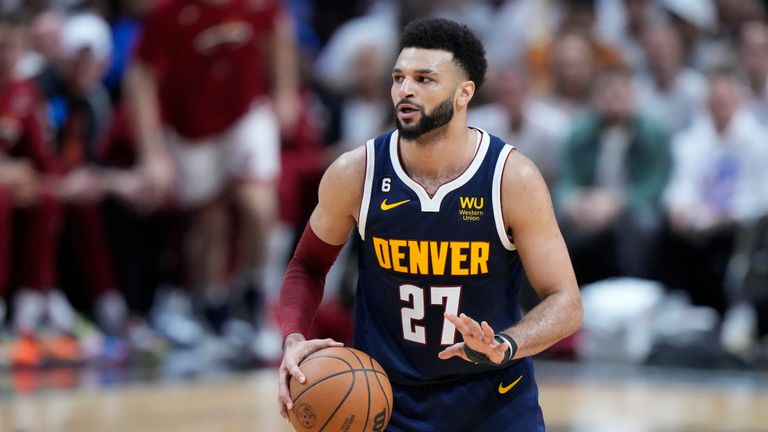 Denver Nuggets guard Jamal Murray (27) looks to pass during the first half of Game 4 of the basketball NBA Finals against the Miami Heat, Friday, June 9, 2023, in Miami. (AP Photo/Wilfredo Lee)


