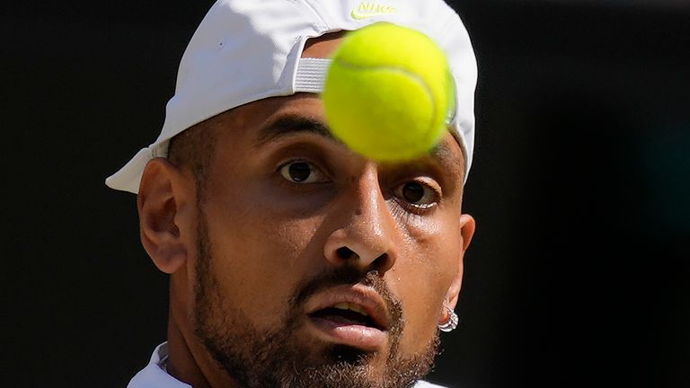 Australia's Nick Kyrgios returns to Serbia's Novak Djokovic in the final of the men's singles on day fourteen of the Wimbledon tennis championships in London, Sunday, July 10, 2022. (AP Photo/Kirsty Wigglesworth)