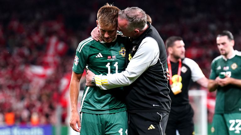 Michael O'Neill comforts Callum Marshall after his dramatic equaliser was ruled out after a lengthy VAR review