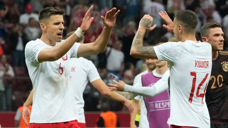 Poland players celebrate their victory at the international friendly soccer match between Poland and Germany at the Narodowy stadium in Warsaw, Poland, Friday, June 16, 2023. (AP Photo/Czarek Sokolowski)