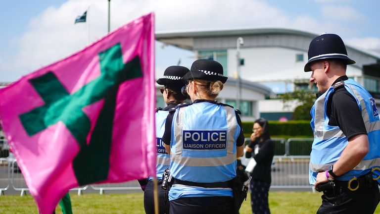 Police liaison officers monitor the situation at Epsom 