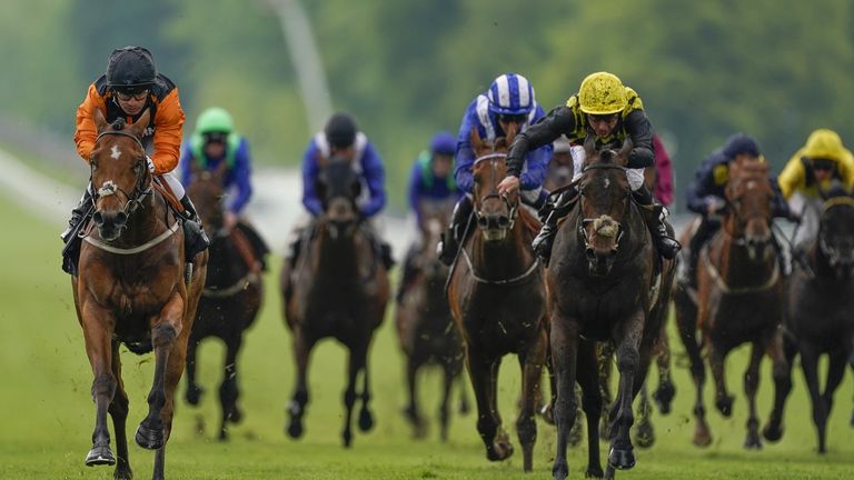 Silvestre De Sousa riding Rhoscolyn (left) to victory at Goodwood