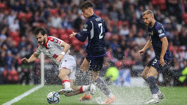 GLASGOW, SCOTLAND - JUNE 20: Scotand&#39;s Aaron Hickey and Georgia&#39;s Khvicha Kvaratskhelia during a UEFA Euro 2024 qualifier between Scotland and Georgia at Hampden Park, on June 20, 2023, in Glasgow, Scotland. (Photo by Craig Williamson / SNS Group)