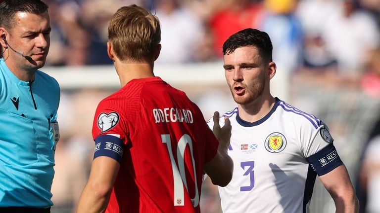 Scotland's Andy Robertson and Norway's Martin Odegaard shake hands ahead of their Euro 2024 qualifier